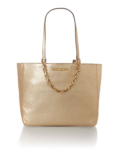 michael kors gold purse lock|Michael Kors gold tote handbags.